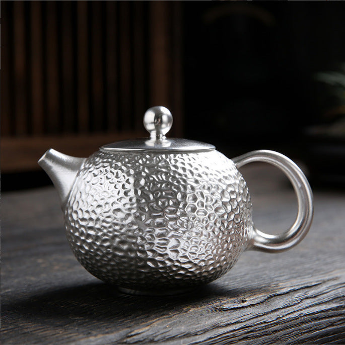 Silver teaware for a comparison of tea brewing materials