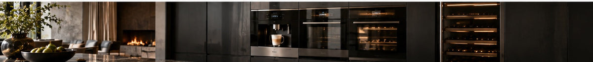 THE LUXE JOURNAL built-in coffee machine guide featuring a fully integrated black appliance wall in a luxury kitchen