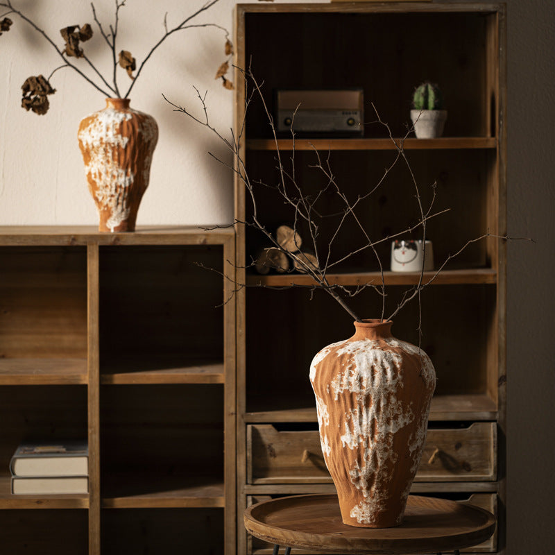 Rustic orange white ceramic vase styled in dark wood New Chinese interior