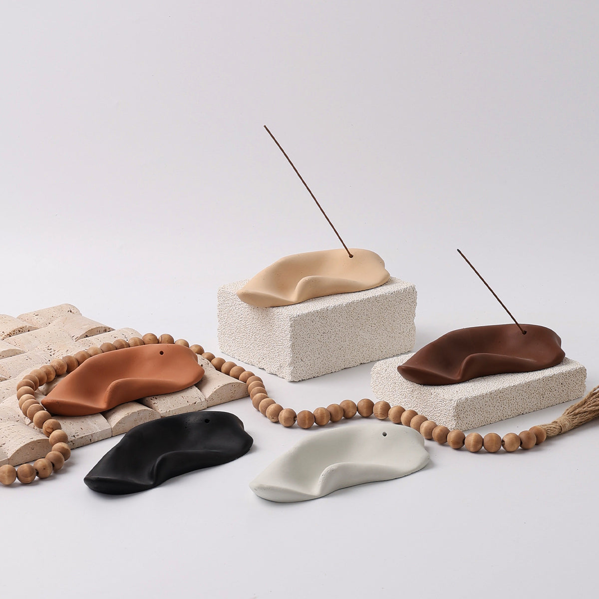 Five color sculptural ceramic incense trays in ivory beige black terracotta and brown