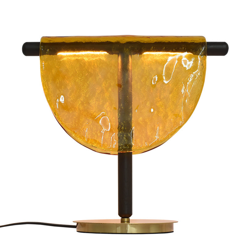 Amber semicircle glass bedside lamp in modern hotel style interior