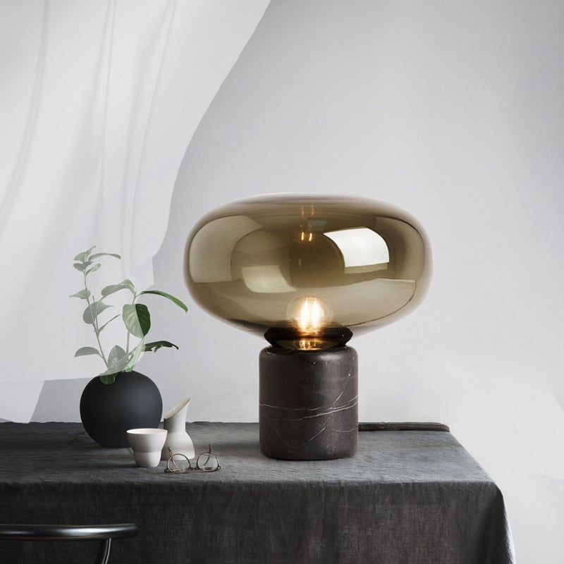 Amber mushroom glass lamp with black marble base