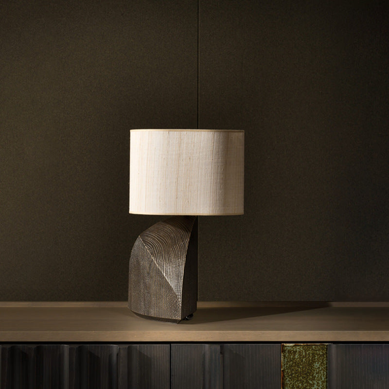 Grey sculptural faceted table lamp with light fabric shade