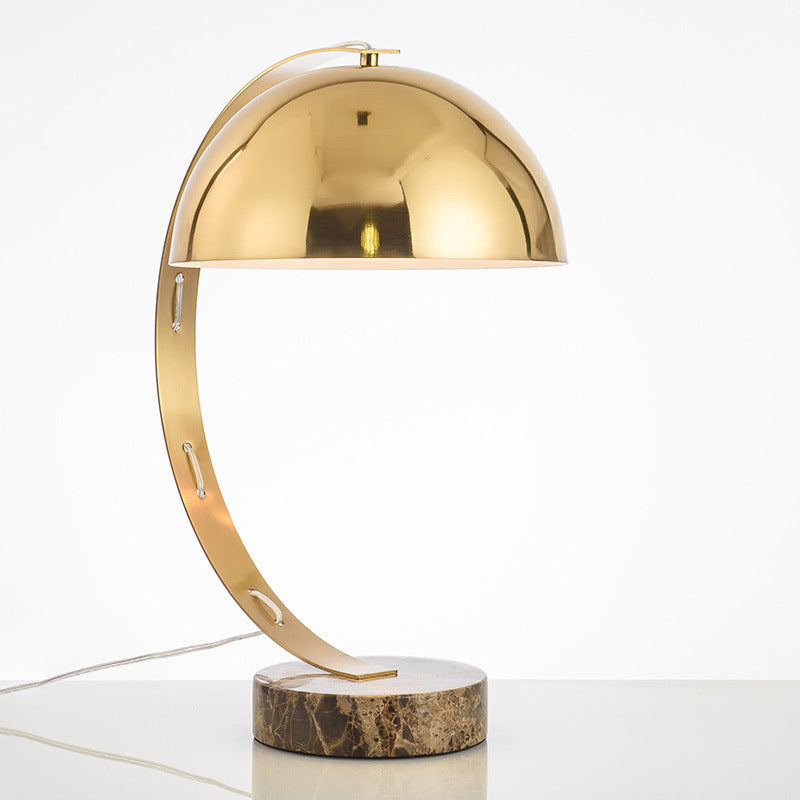 Modern gold dome table lamp with sculptural arc and marble base