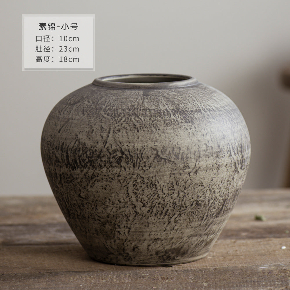 Small rounded weathered grey brown ceramic vase 18 cm high