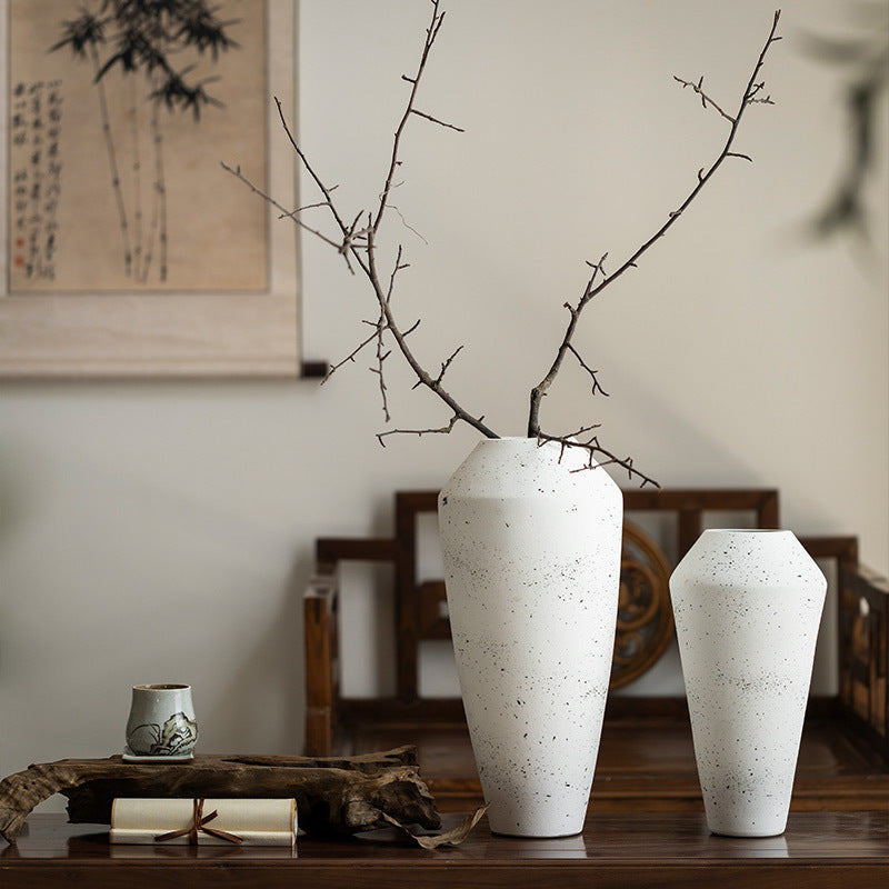 Two ivory white speckled ceramic vases in 35 and 45 cm sizes