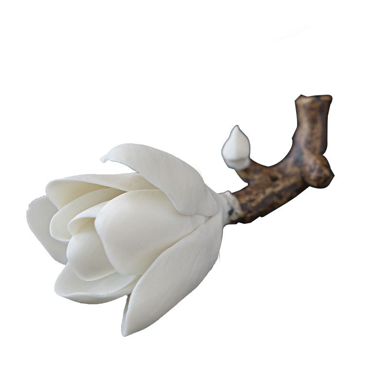 White ceramic magnolia flower incense holder isolated on white background