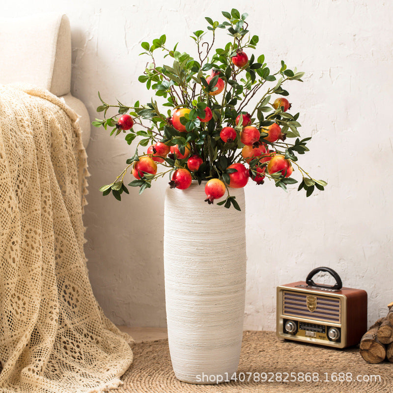 Ivory white horizontal ribbed ceramic floor vase with pomegranate branches
