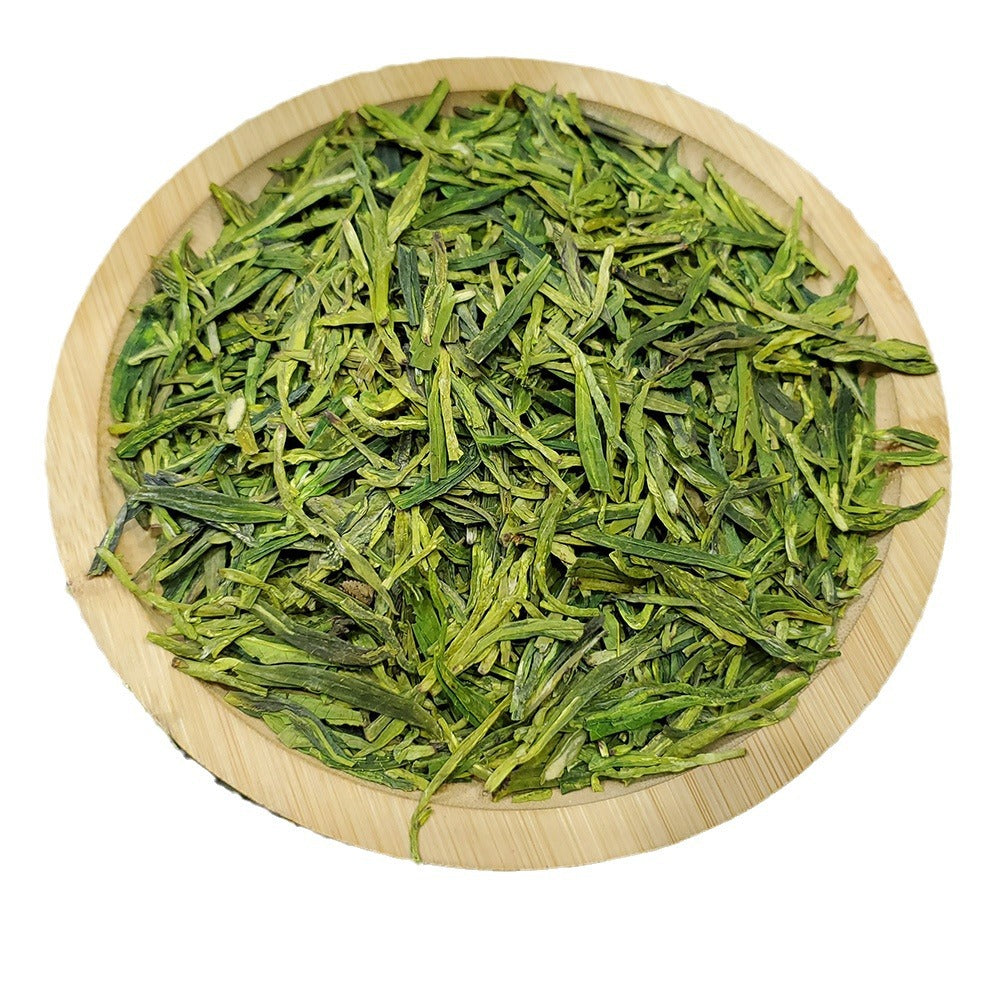 Longjing green tea leaves in bamboo tray