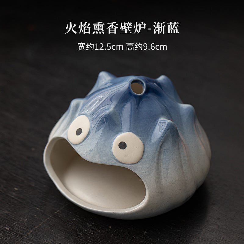 Mist blue cartoon flame ceramic Palo Santo and sage burner approximately 12.5 cm wide