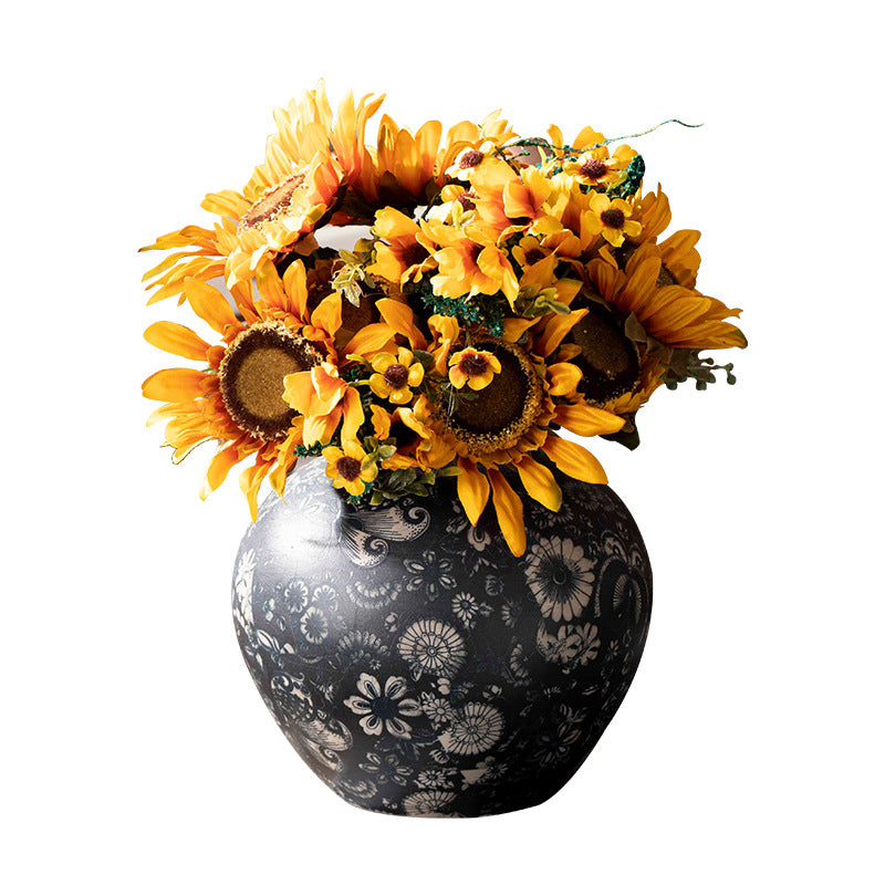 Indigo floral ceramic vase styled with yellow flowers