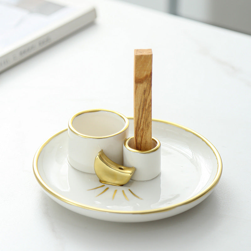 Ivory gold ceramic sacred wood tray holding Palo Santo stick upright
