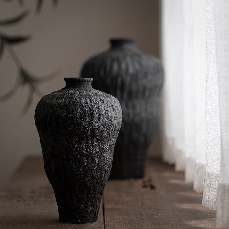 Small charcoal black textured ceramic vase in wabi-sabi interior