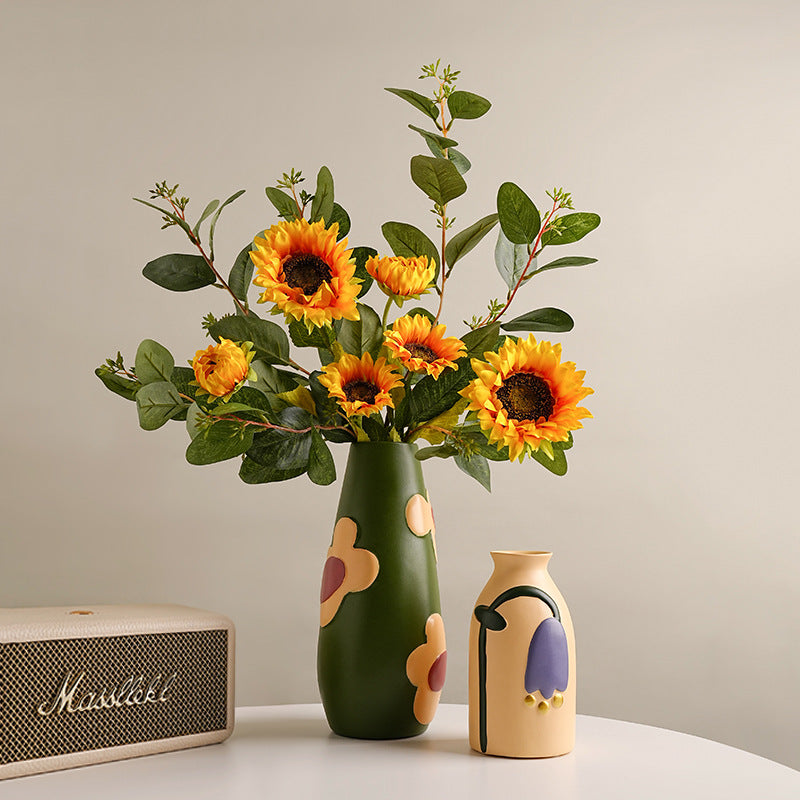 Colorful hand-painted ceramic vase set with olive green flower vase and cream tulip vase styled with sunflowers