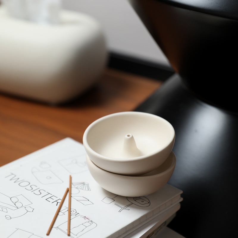 Round ceramic incense bowl with central holder detail in milk white