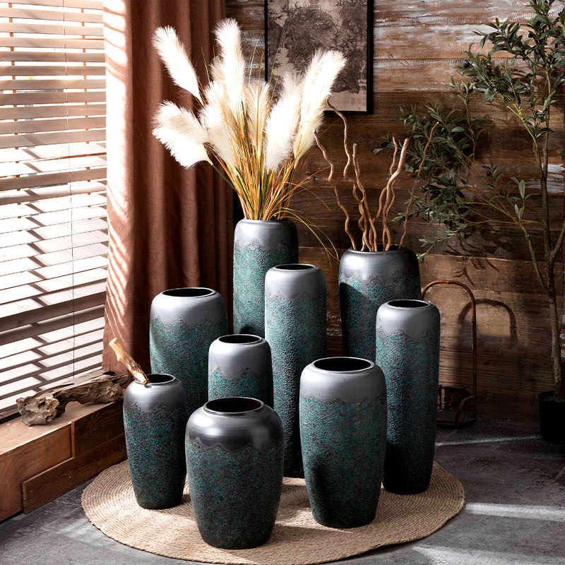Green patina floor vase collection arranged in slim and wide silhouettes