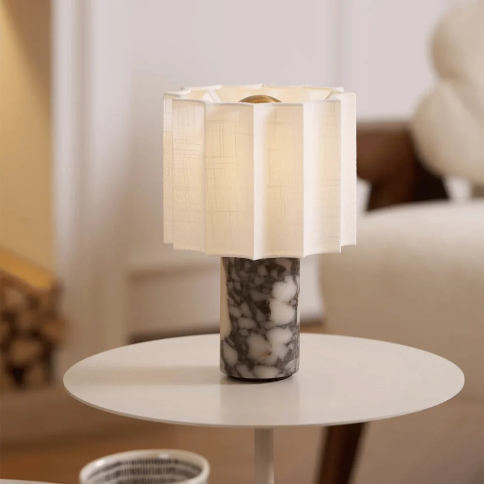 Bulgari marble table lamp with pleated fabric shade on side table