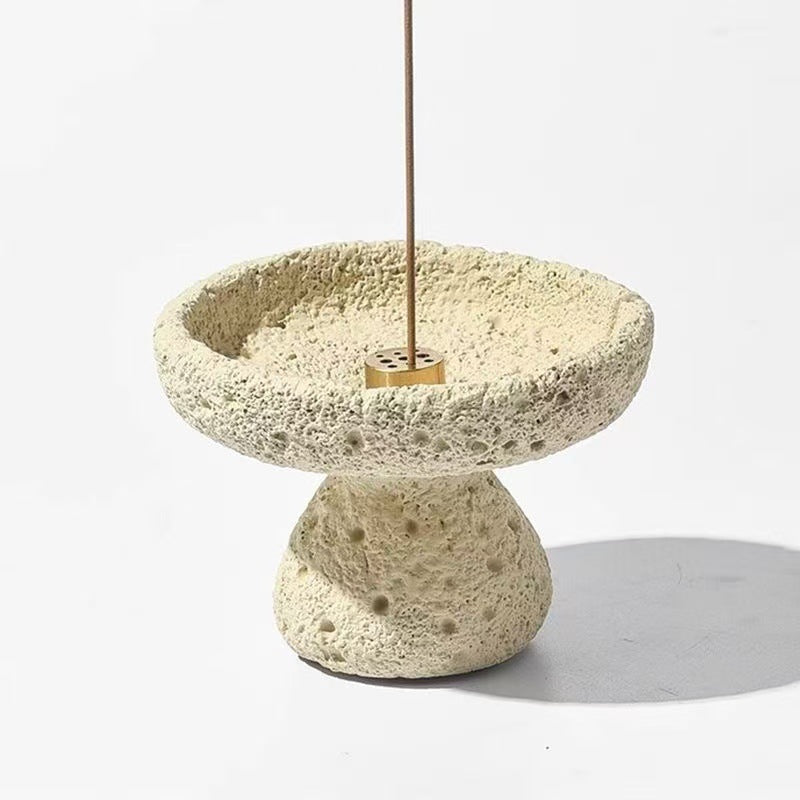 Sand beige pedestal incense holder with thin incense stick in brass insert
