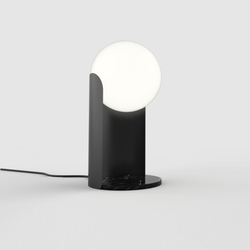 Architectural black globe lamp with warm ambient glow
