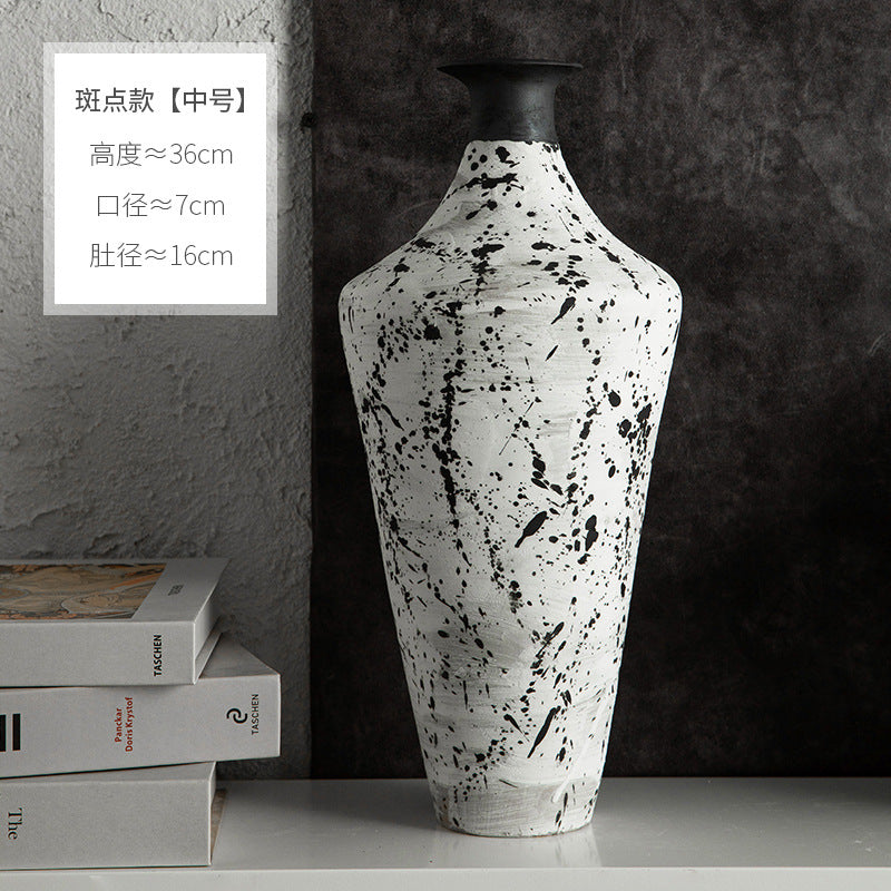 Tall black and white splatter ceramic bottle vase approximately 36 cm high
