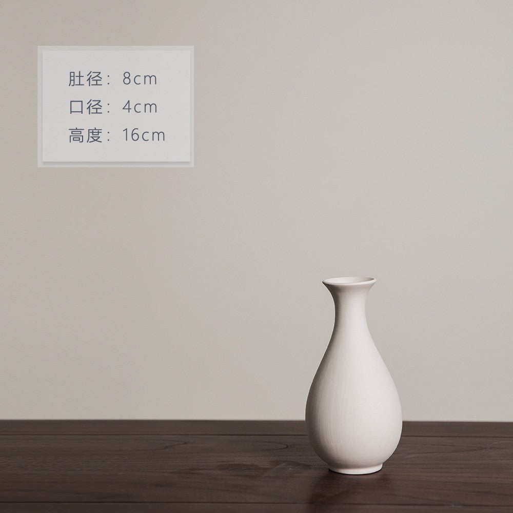 Matte ivory pear-shaped ceramic bud vase, 16 cm high