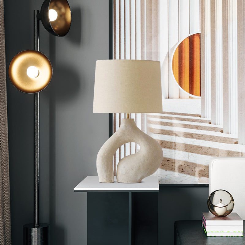 63cm sculptural resin loop table lamp with ivory drum shade in modern interior