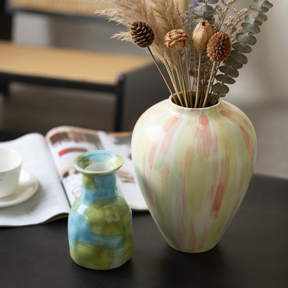 Blue green bottle vase and pastel stripe vase styled together