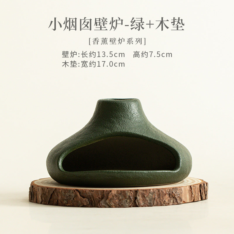 Forest green ceramic ritual fireplace with natural wood coaster
