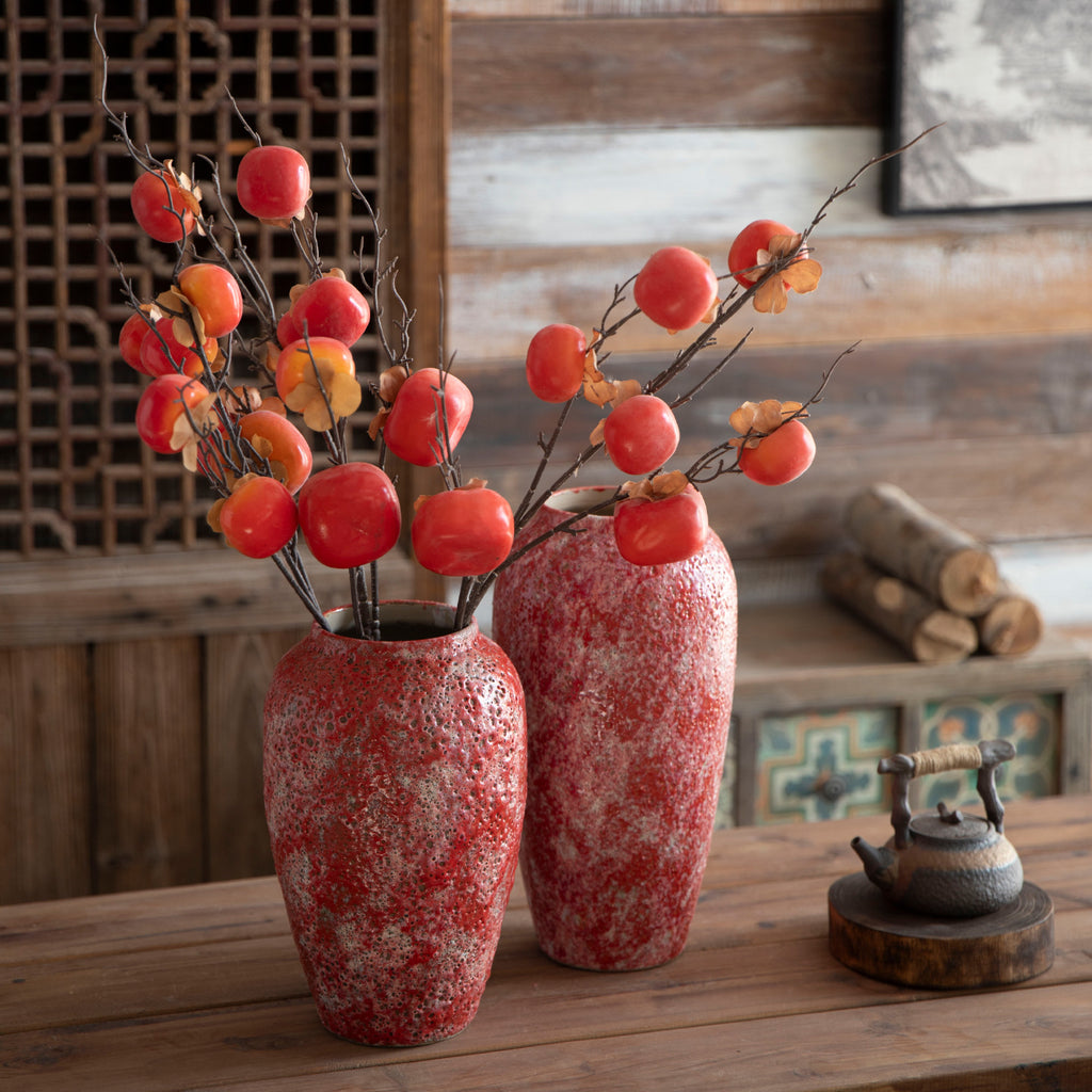 Medium and large berry red ceramic vases with fruit branches