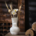 Ivory white rustic ceramic bud vase with dried flower arrangement