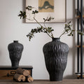 Charcoal black irregular-texture ceramic vase with branch arrangement