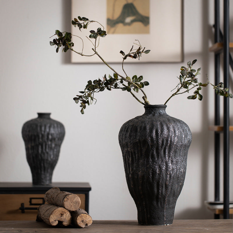 Charcoal black irregular-texture ceramic vase with branch arrangement