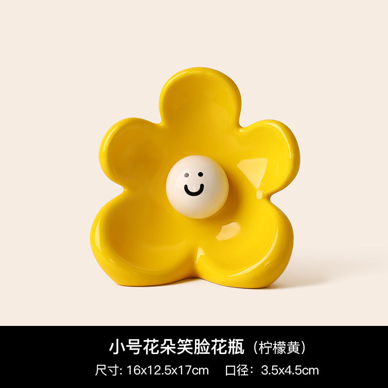 Bright yellow smiley flower ceramic vase with glossy petal shape