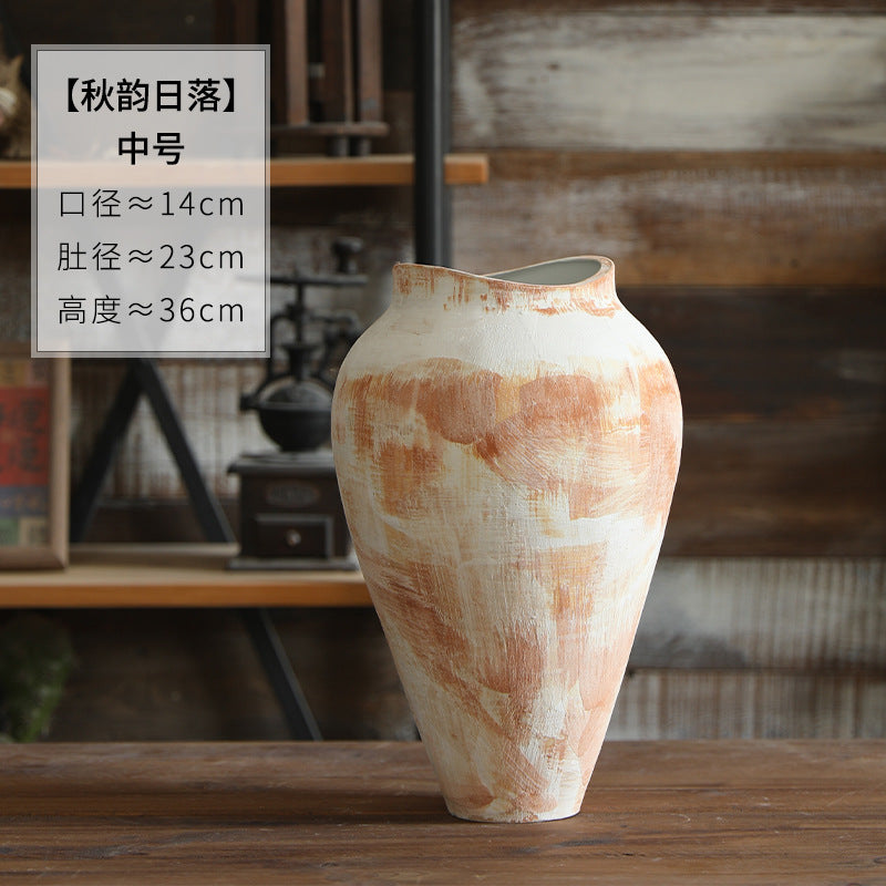 Cream and terracotta abstract brush-painted ceramic vase styled with branches