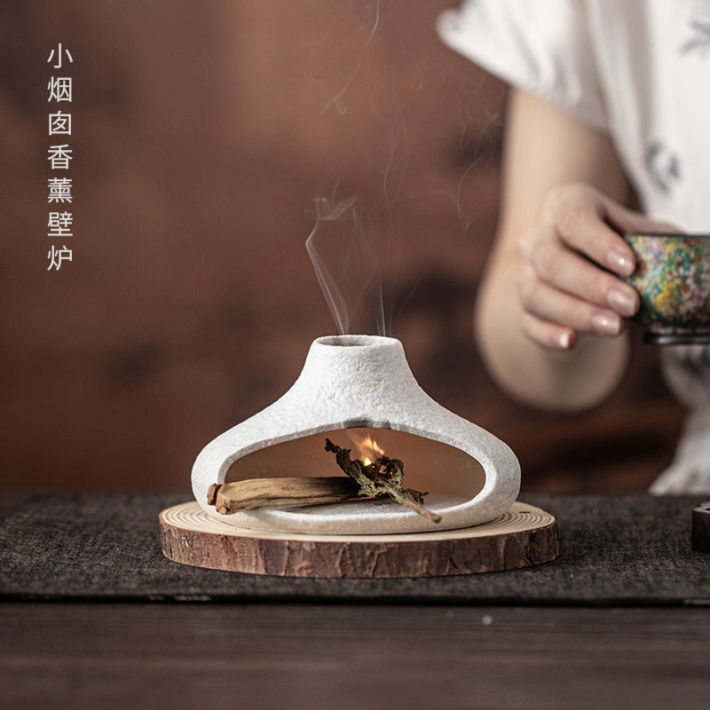 White low chimney ceramic Palo Santo and sage burner in tea room setting