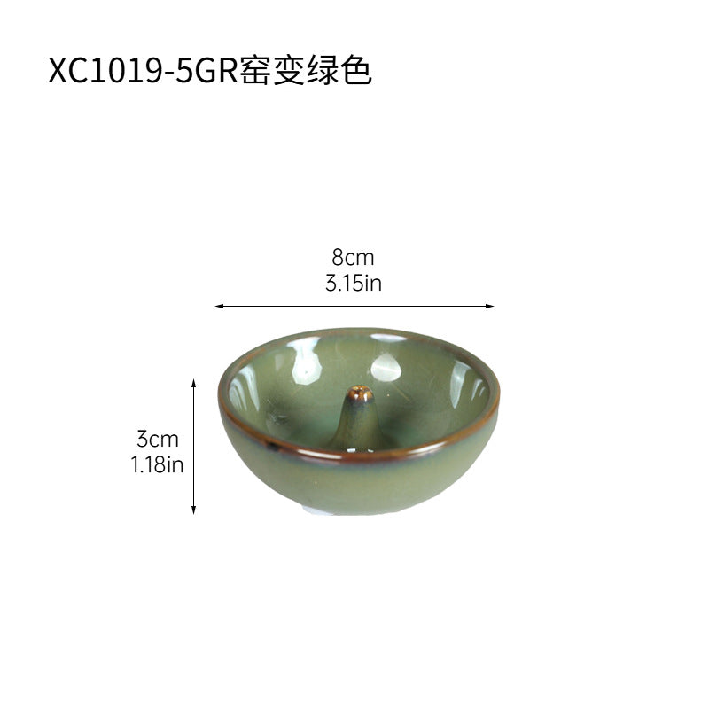 Kiln glazed green round ceramic incense holder 8 cm diameter by 3 cm high
