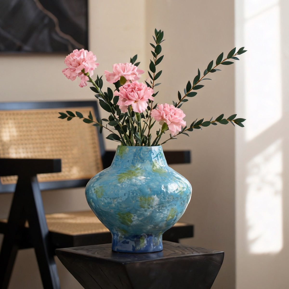 Turquoise blue mottled ceramic vase with pink floral arrangement