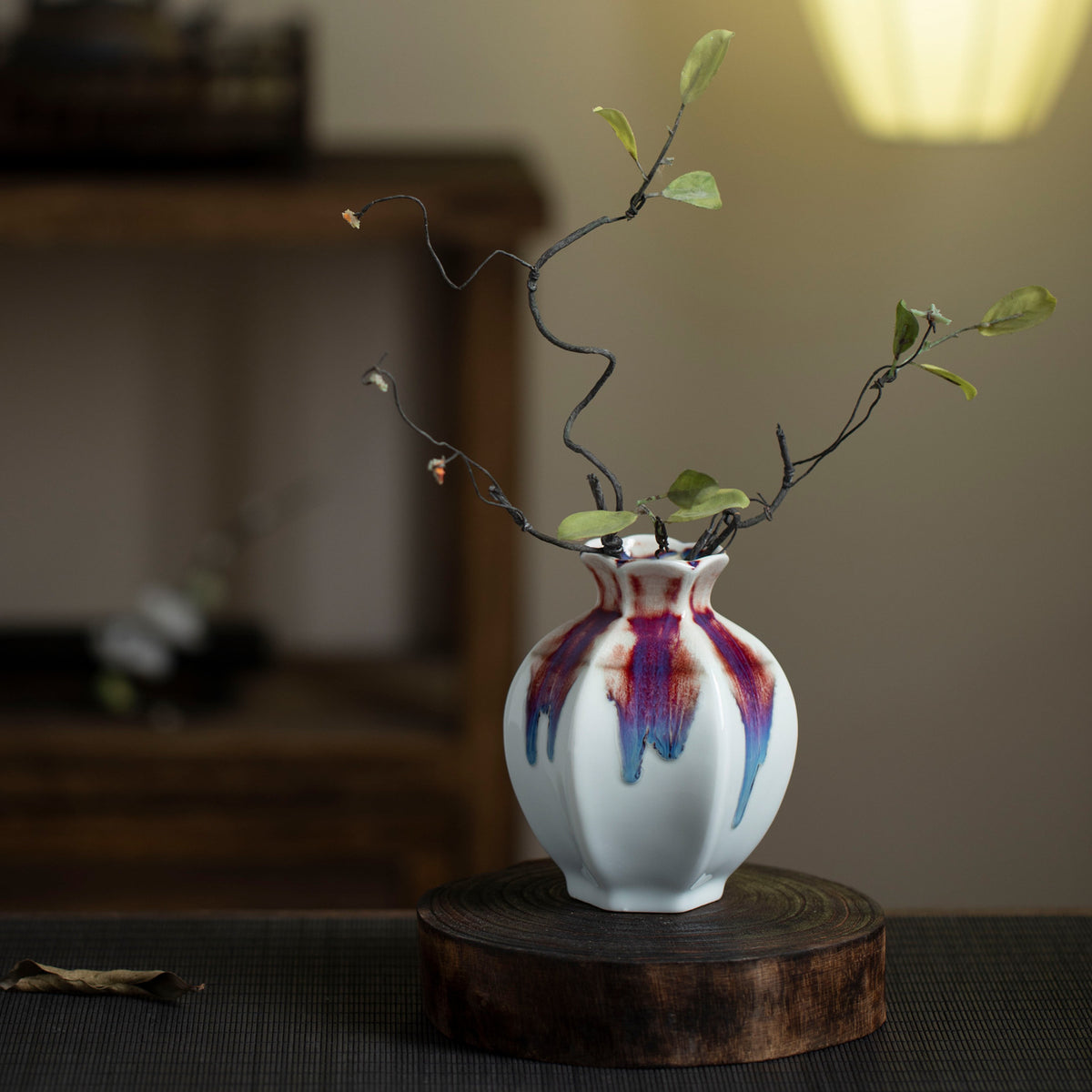 White rainbow drip-glaze ceramic bud vase in New Chinese interior