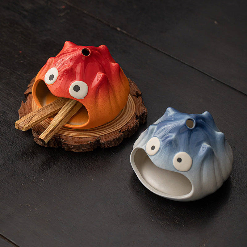 Fire red and mist blue cartoon flame ceramic ritual burners displayed together