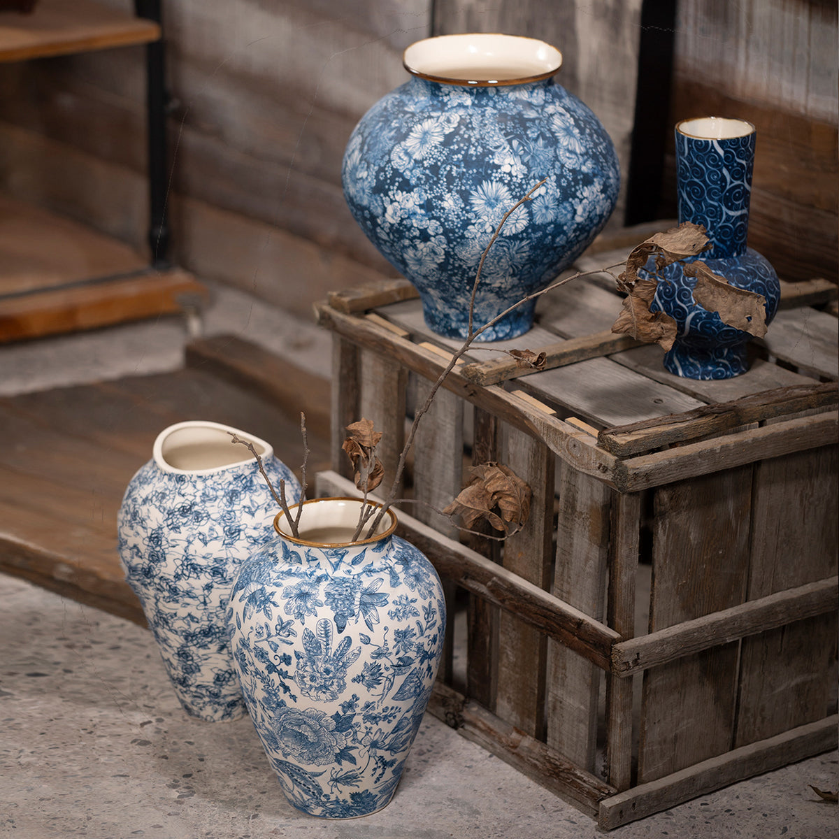 Indigo blue white floral ceramic vase collection styled on rustic crates