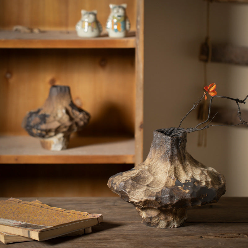 Textured sculptural ceramic vase styled in rustic wabi-sabi interior