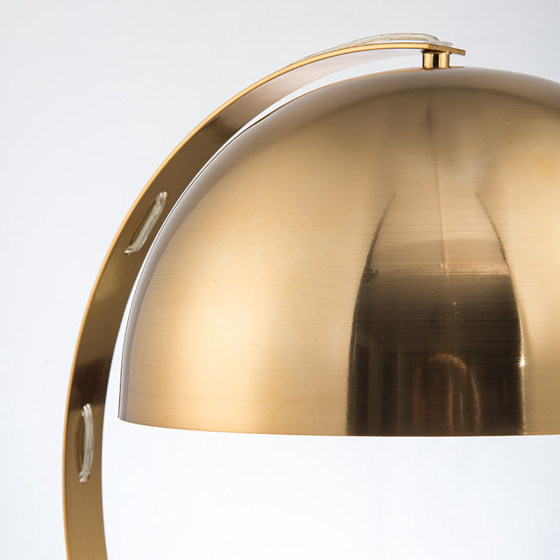 Brushed brass arc dome table lamp with brown marble base close detail