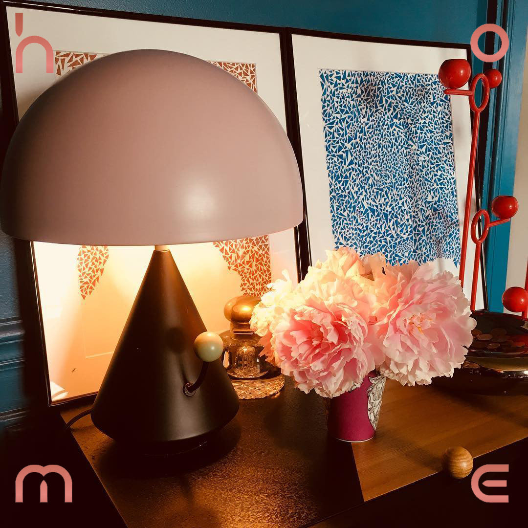 Blush pink sculptural mushroom table lamp styled in colorful interior