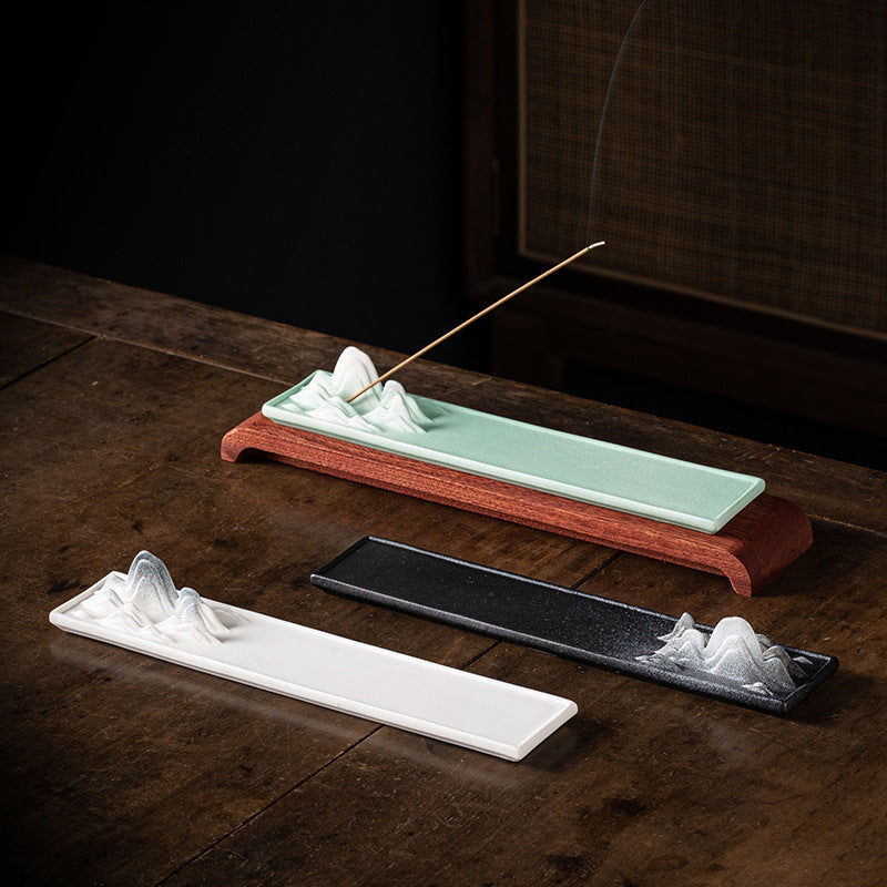 White celadon green and black Chinese landscape incense trays displayed together