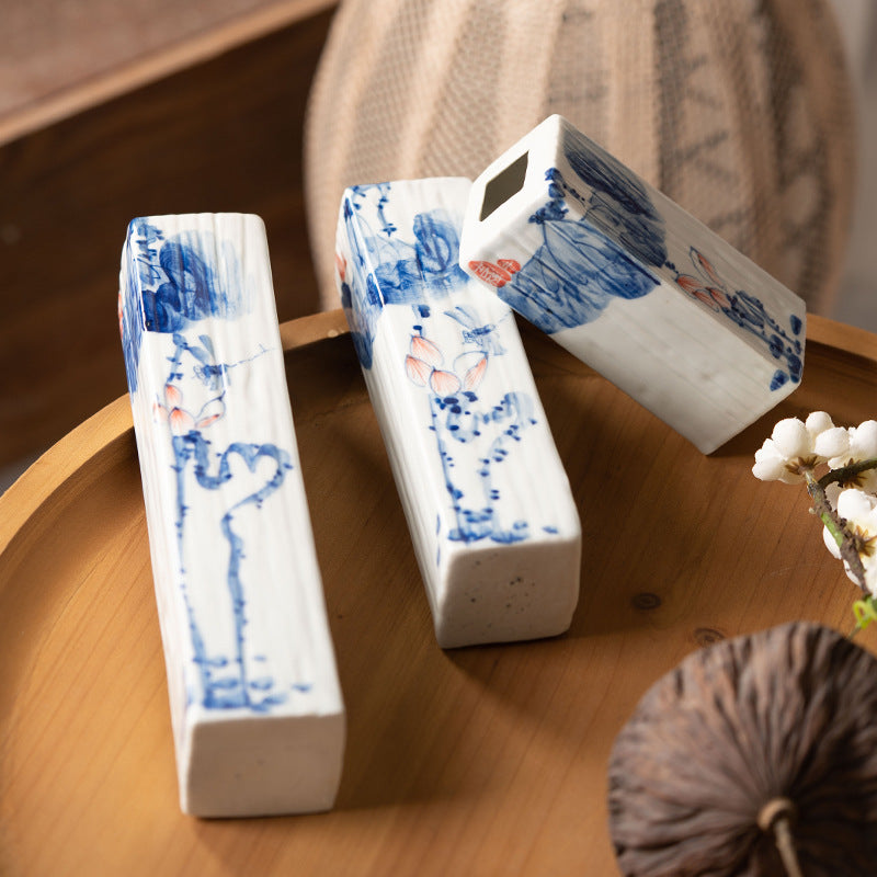 Hand-painted blue white lotus rectangular ceramic bud vases displayed together