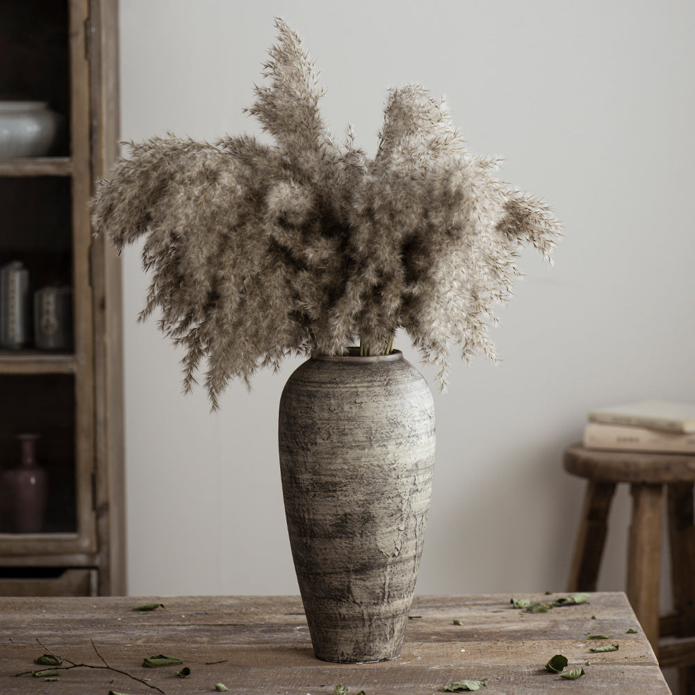 Tall rustic grey brown ceramic vase styled with pampas grass