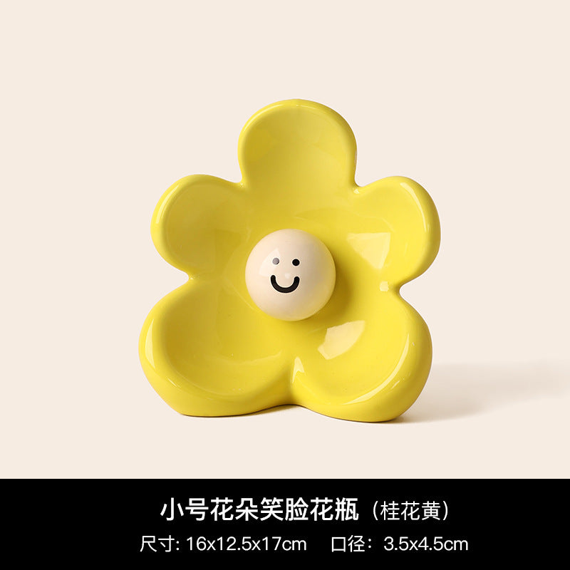 Lemon yellow smiley flower ceramic vase with glossy sculptural petals