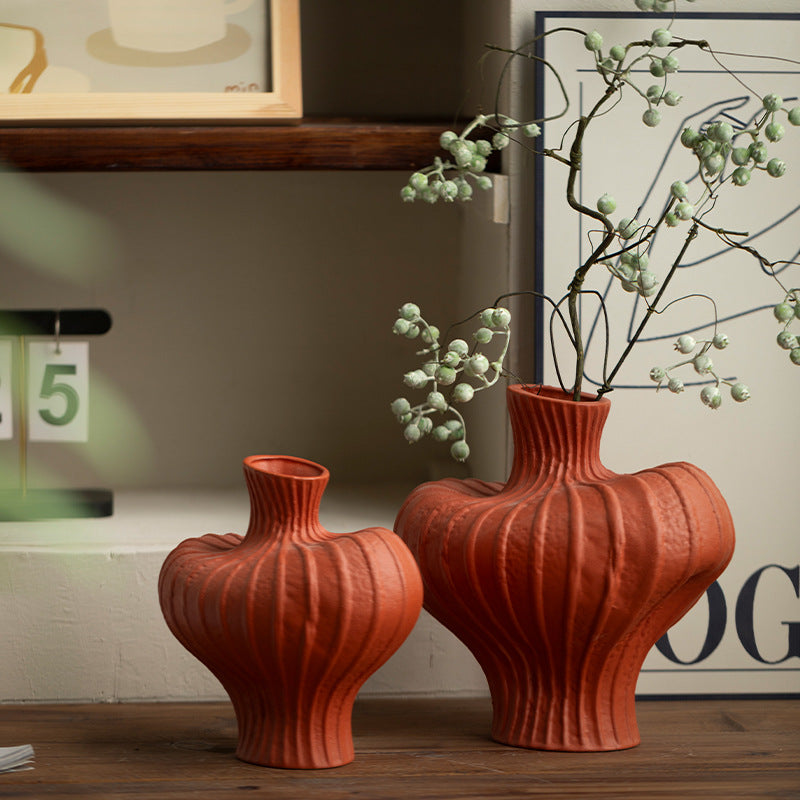 Pair of terracotta red sculptural ribbed vases for tabletop decor