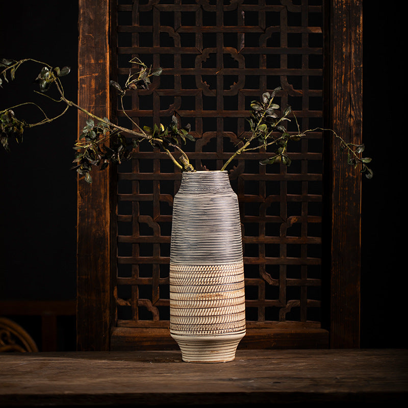 Large grey ochre textured ceramic vase styled with leafy branches