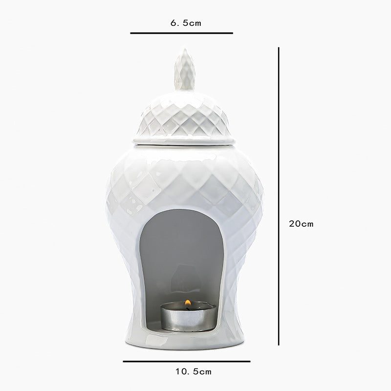 White ceramic essential oil burner approximately 10.5 cm wide and 20 cm high